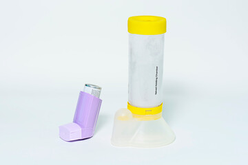 Closeup shot of valved holding chambers on a white background