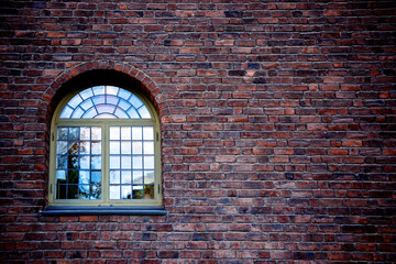 Beautiful shot of a modern window on a red brick wall of a building in Sweden