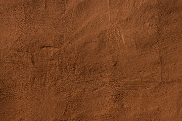 Copper colored wall texture background with textures of different shades of copper or bronze