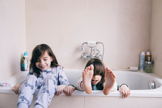 Playful girls enjoying together in bathtub