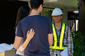 Happy homeowner stand in front of contractor and shake hand, handyman holding clipboard and after checking details before renovations home, house improvement interior, Interior design