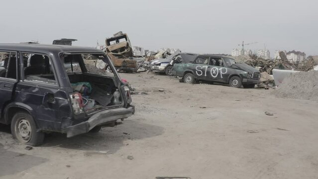 Cemetery of destroyed cars after the evacuation of the inhabitants of the city of Bucha. Ukraine. Grod Bucha. War in Ukraine. Shot cars.