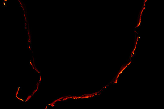 Burning Paper, Glowing Edge Of Paper On A Black Background