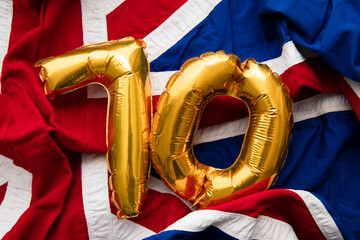Number 70 balloons on a united kingdom union jack flag. Patinum jubilee celebrations