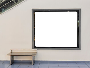 Blank billboard mock up on the wall beside the escalator at shopping mall. Advertising concept - stock photo