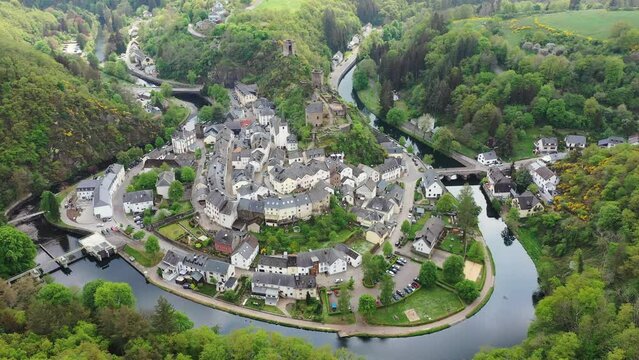 Aerial view of Esch-sur-Sure, medieval town in Luxembourg, dominated by castle, canton Wiltz in Diekirch. Forests of Upper-Sure Nature Park, meander of winding river Sauer, near Upper Sauer Lake.