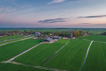 Aerial view of a village and farm agriculture fields in the countryside in Netherlands