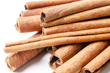 Group of cinnamon sticks on white background