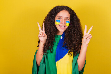 Brazilian, Caucasian girl, expression of peace and love, fingers raised, happy pose for photo....