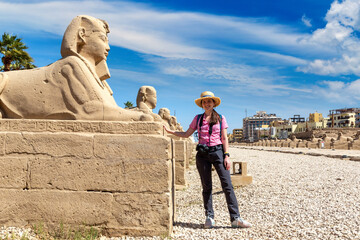 Woman tourist at Sphinx Allee in Luxor