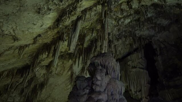 The cave of Zeus full of stalactites.A depths and a green cave.Down to up shot
