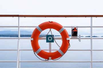 red life buoy. Ring life boy on big boat.Obligatory ship equipment. Orange lifesaver on the deck of...