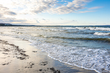 Fototapeta na wymiar Beautiful seascape with clear blue sky, waves on the sea.