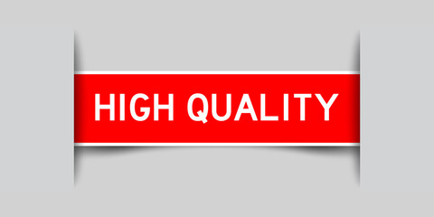 Inserted red color label sticker with word high quality on gray background