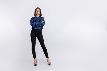 Photo of self-assured lady crossed hands posing wear dotted blouse stilettos isolated grey color...