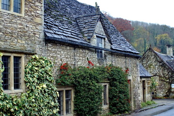 Quaint house covered in ivy in Castle Combe, England