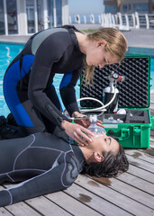 Scuba Diving rescue course skills providing oxygen to injured or unconscious diver