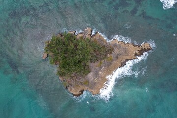 Island in the middle of the sea at Arroyo Salado Beach in Cabrera