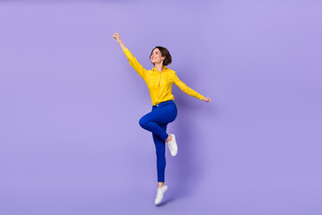 Fototapeta na wymiar Full body photo of hooray young lady jump wear smart casual isolated on violet background