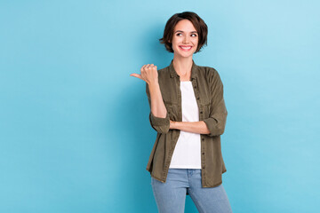 Photo of impressed millennial short hairstyle lady indicate promo wear trend cloth isolated on blue...