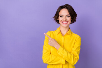 Photo of cute young bob hairdo lady index promo wear yellow blouse isolated on violet color...