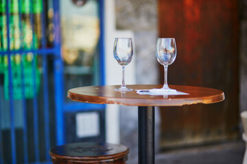 Two wine glasses on table of street cafe in Bermeo, Basque Country, Spain