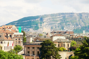 Fototapeta na wymiar View of the roofs of Geneva city and mountains.