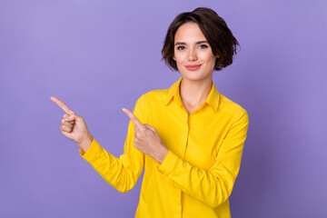 Photo of nice young lady index promo wear yellow shirt isolated on purple color background