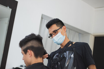 a barber motilating a boy