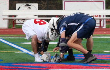 Face off during a high school boys locrosse game