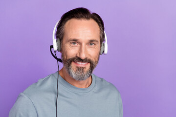 Photo of mature cheerful man expert wear headset agent manager isolated over violet color background