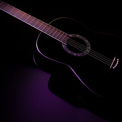 Fototapeta na wymiar black guitar against a dark background, isometric view. guitar music low-key concept
