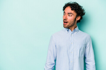 Young caucasian man isolated on white background being shocked because of something she has seen.