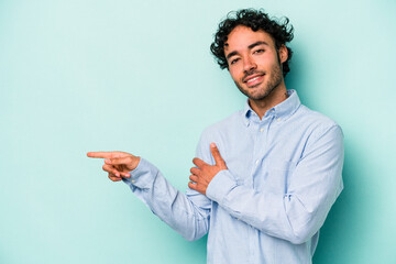 Young caucasian man isolated on white background smiling cheerfully pointing with forefinger away.