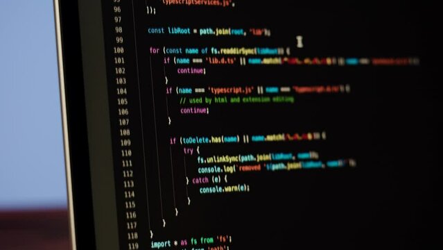 Programmer using laptop. Program code and script data on the screen close-up. Hacker attack. 