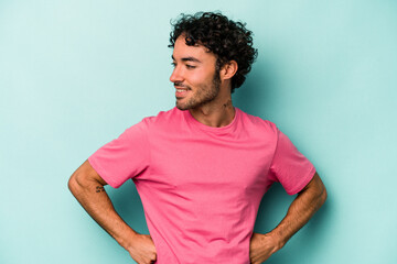 Young caucasian man isolated on white background laughs happily and has fun keeping hands on...