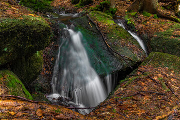 Cerveny creek with Cerveny waterfall in Jizerske mountains in spring morning