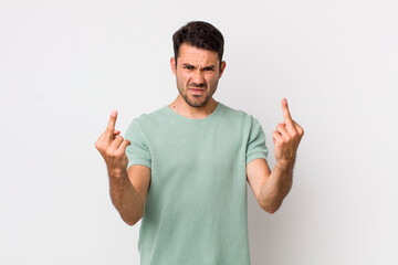 young handsome hicpanic man feeling provocative, aggressive and obscene, flipping the middle...