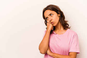 Fototapeta premium Young hispanic woman isolated on white background who feels sad and pensive, looking at copy space.