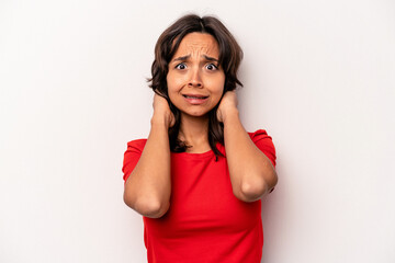 Young hispanic woman isolated on white background screaming with rage.