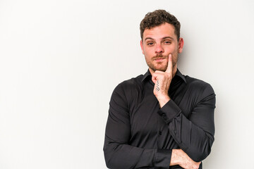Young caucasian man isolated on white background looking sideways with doubtful and skeptical expression.
