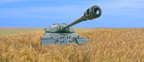 Old tank on the field of yellow wheat and blue sky. The concept of war in Ukraine