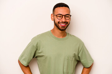 Young hispanic man isolated on white background happy, smiling and cheerful.