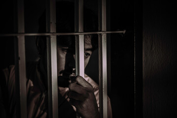Hands of men desperate to catch the iron prison,prisoner concept,thailand people,Hope to be free.