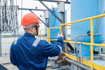 Water plant maintenance technicians, mechanical engineers check the control system at the water treatment plant.