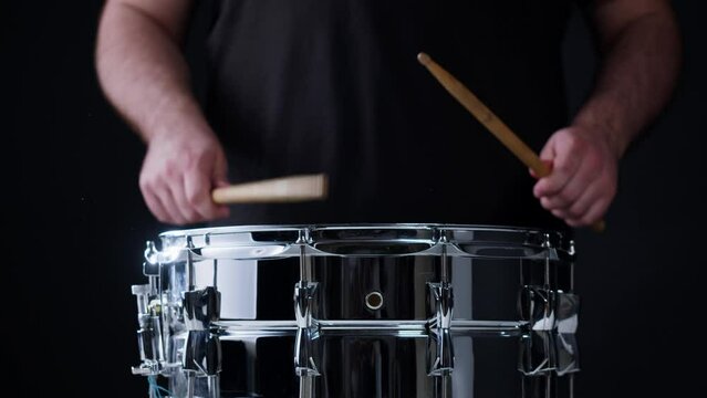 Playing drums close-up. Drummer playing musical instrument, professional musician player. 