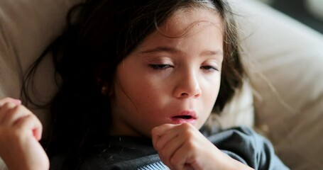Hypnotized little girl by media entertainment portrait female child sitting on couch