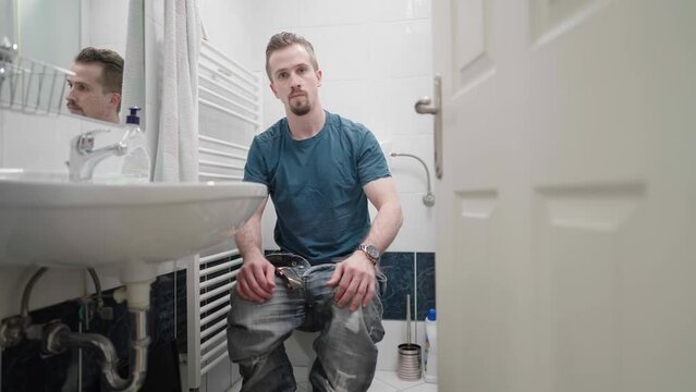 Opening door to bathroom invasion of privacy man on toilet 4K