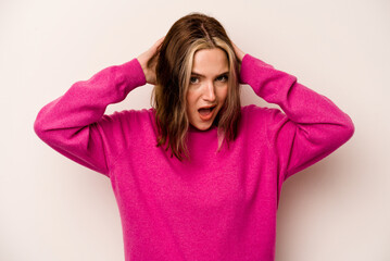 Young caucasian woman isolated on white background screaming, very excited, passionate, satisfied with something.