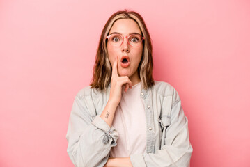 Young caucasian woman isolated on pink background having some great idea, concept of creativity.